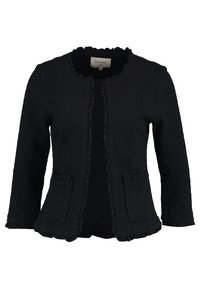 Cardigan noir avec tissu texturé, encolure arrondie, bords à volants et deux poches avant. Fermeture avant ouverte sans boutons.