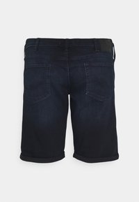 Dark blue denim shorts with a cuffed hem, featuring two back pockets and a leather patch at the waistband. Smooth texture and classic design.
