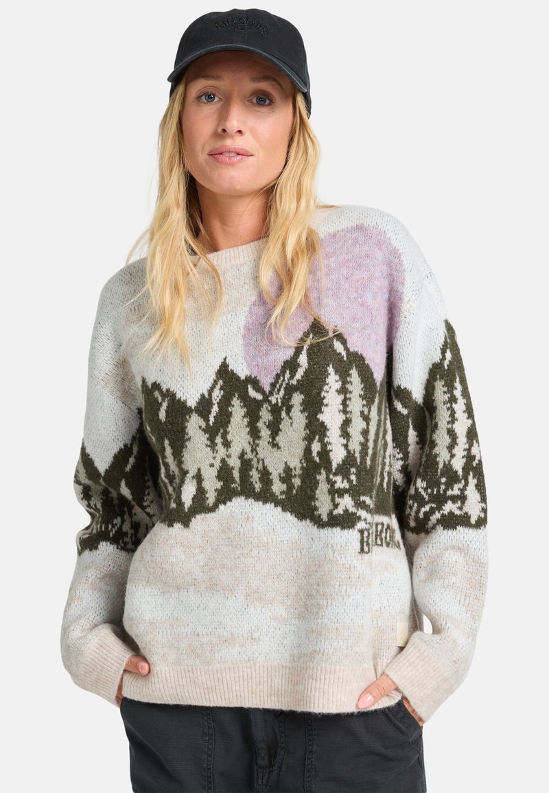 Pull en tricot avec motif montagne dans des tons terreux et textures douces. Encolure ronde et poignets côtelés complètent le design décontracté.