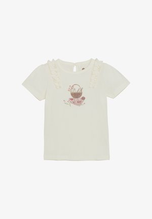 Jasna kremowa koszulka z krótkimi bufkami, falbankami na ramionach oraz nadrukowanym wzorem kosza z kwiatami na przodzie.