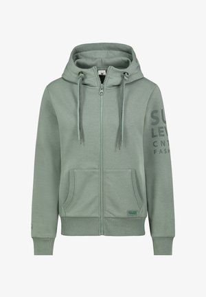 Light green zip-up hoodie made of soft fabric, featuring a kangaroo pocket, drawstring hood, and printed text on the sleeve.