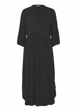 Abito nero realizzato in tessuto leggero, con collo alto, bottoni frontali, maniche a 3/4 e vita arricciata per una silhouette fluida.