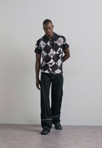 MARINE SERRE MOON LASER CURVED - Blugi loose fit - black