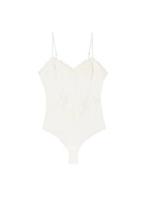 Body blanco de encaje con tirantes finos ajustables, bordes festoneados y detalle de bordado floral.