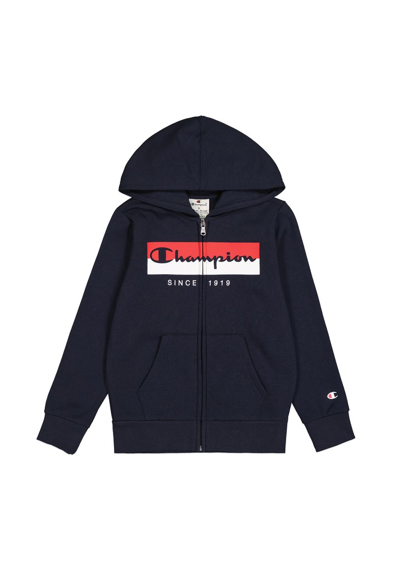 Felpa zip in navy in cotone, con una grafica frontale che presenta il testo "Champion" in rosso e bianco. Comprende un cappuccio e tasche laterali.