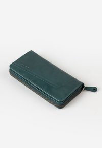 Teal leather wallet with a zip-around closure, smooth texture, and minimalist design. Features stitching details along the surface.