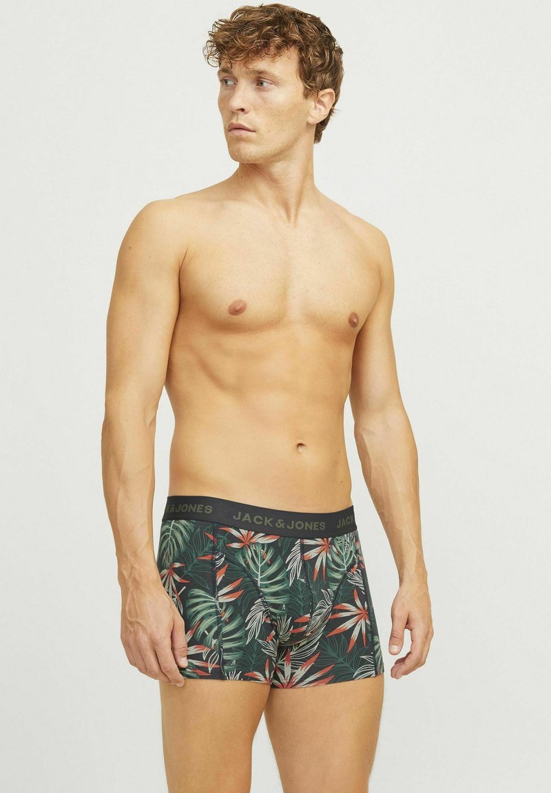 Boxershorts met een donkere groene basis en een tropisch bladerenpatroon in tinten van rood en groen, elastische tailleband met logo-detail.