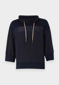 Granatowy sweter z wysokim kołnierzem, rękawami o długości 3/4 i regulowanymi sznurkami. Miękka, gładka tkanina z lekkim połyskiem.
