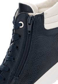 Navy leather high-top shoe featuring a side zipper, thick laces, and a white sole. Textured surface with a smooth collar and contrasting accents.
