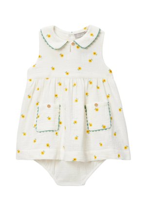 Robe de bébé blanche avec imprimé de fleurs jaunes, bordure verte festonnée sur le col et les poches, boutons en bois et bloomer intégré.