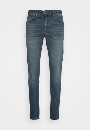 Donkerblauwe denim jeans met een slim fit, met een sluiting met knoop en rits aan de voorkant, vijf zakken en een subtiele vervaging op de bovenbenen.