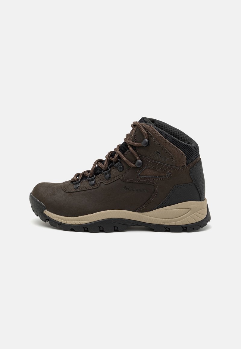 Brown hiking boots made of suede and mesh, featuring a padded collar, lace-up front, and rubber outsole with grip patterns.