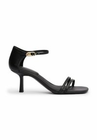 Sandalini neri in pelle con tacco alto, dotati di una delicata cinghia alla caviglia, accento in fibbia dorata, punta aperta e due sottili cinghie orizzontali sul vamp.