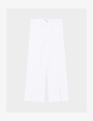 Valged laiad püksid eesos lõhikutega, nööbi ja tõmblukuga kinnitusega ning kitsaste vööaasadega vöökoha.