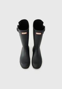 Black rubber rain boots with a glossy finish, rounded toe, and adjustable buckle on the side. Features Hunter branding in red.