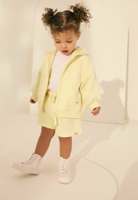 Next REGULAR FIT  - Pantalon de survêtement - yellow
