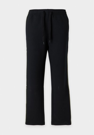 Pantalon de jogging noir à coupe droite avec taille élastique et cordons noirs, présenté sur un fond gris clair uni.