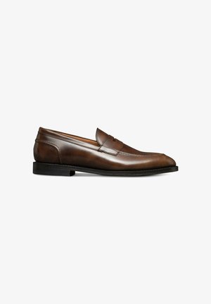 Brown leather slip-on shoe with a smooth finish, rounded toe, subtle stitching accents, and a low black stack heel.