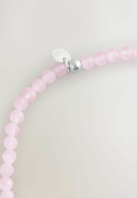 Faceted rose quartz beads in light pink, strung with a silver clasp, featuring a round metallic accent at the closure.