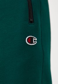 Champion ICONS CUFF PANTS - Treniņtērpa apakšdaļas - green