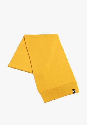 Yellow knitted scarf with a soft texture, rectangular shape, and ribbed ends. Features a small black logo tag on one edge.