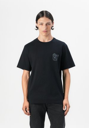 Black cotton t-shirt featuring a chest logo detail. Short sleeves and a crew neckline, with a relaxed fit and smooth texture.