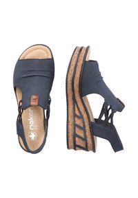Blue wedge sandals with a cork sole, featuring a textured upper, open design, and a decorative accent on the side.