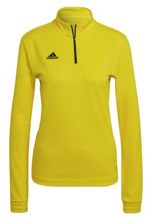 Gelbes sportliches Sweatshirt mit einem Viertel-Reißverschluss-Kragen, langen Ärmeln und schwarzem Adidas-Logo auf der oberen linken Brust. Glattes, strukturiertes Material.