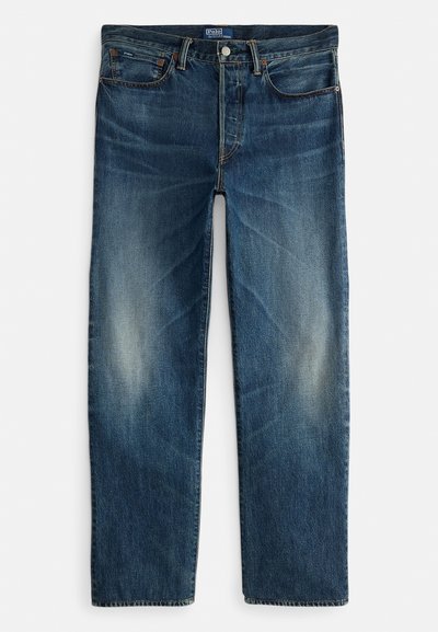 Indigo blå denimjeans med rett ben, femlommersdesign og diskret falming på lårene. Metallknapp og glidelåslukking.