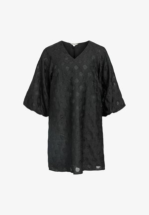 Robe tunique noire texturée avec décolleté en V et manches larges à mi-longueur, présentant des motifs circulaires subtils sur l'ensemble du tissu.