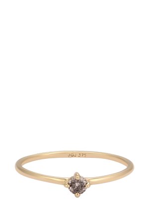 Gold ring featuring a round, brown diamond set in a six-prong setting. Band is slender and polished, marked with "JGJ 375."