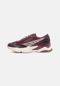 Maroon sneakers with a textured mesh upper, silver accents, and a chunky white and rubber sole; features laces and padded collar.