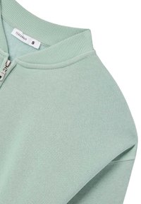 Felpa con zip verde menta, colletto e polsini a coste, con etichetta "Terranova" e taglia "S". Tessuto morbido e testurizzato.