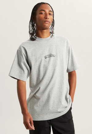 Grå bomulds t-shirt med kortærmer, der har et sort "Off the Wall" logo på brystet, med en afslappet pasform og glat tekstur.