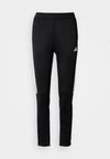 TIRO - Tracksuit bottoms - black/white