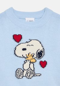 Light blue knit sweater with Snoopy hugging Woodstock and two red hearts on the chest area.
