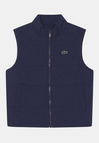 Gilet gonfiabile blu navy con colletto alto, zip frontale e due tasche laterali. Presenta un piccolo logo di coccodrillo verde sul lato sinistro del petto.