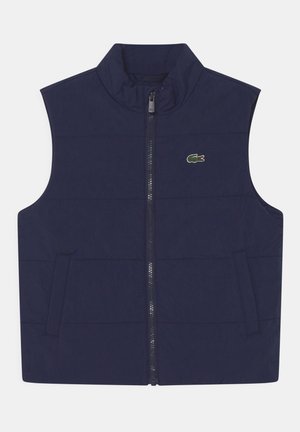 Navyblauw puffer vest met een hoge kraag, een voorkant met rits en twee zijzakken. Bevat een klein groen krokodillogo op de linkerborst.