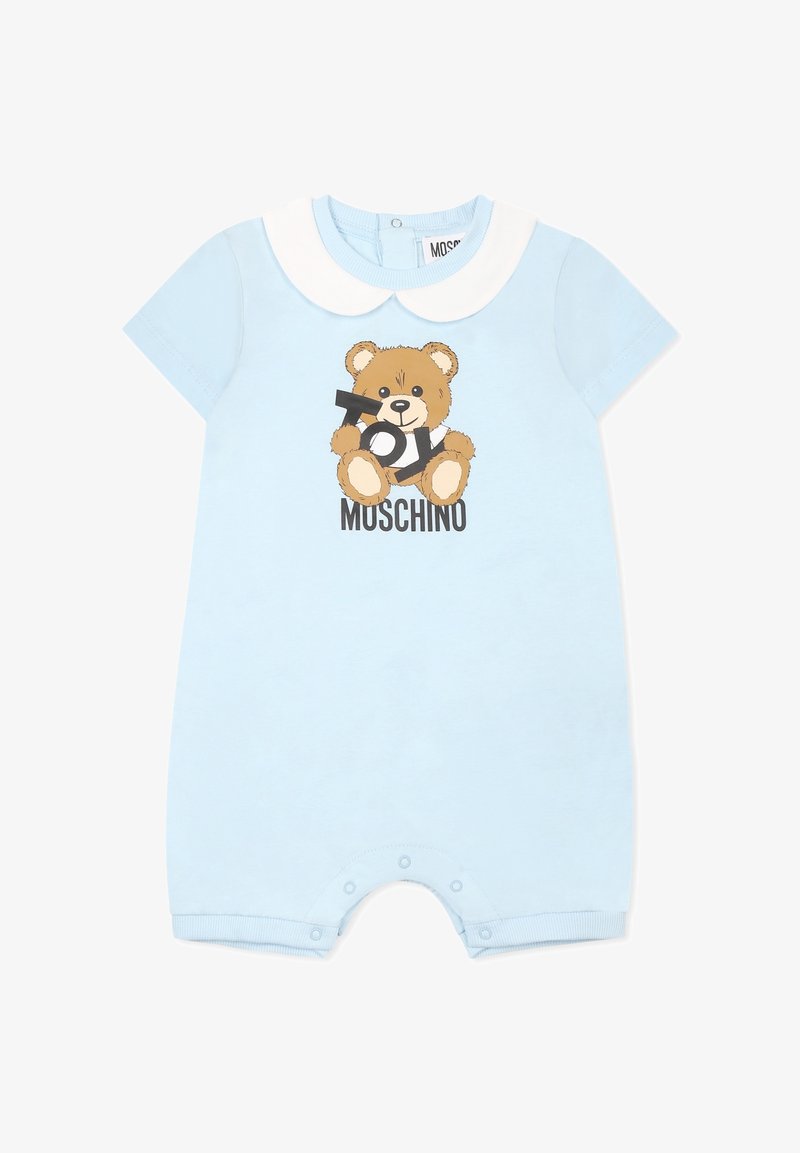 Barboteuse bleu clair pour bébé avec col arrondi blanc, ours en peluche tenant les lettres "Toy" et texte "Moschino" en dessous. Fermetures à pression aux jambes.