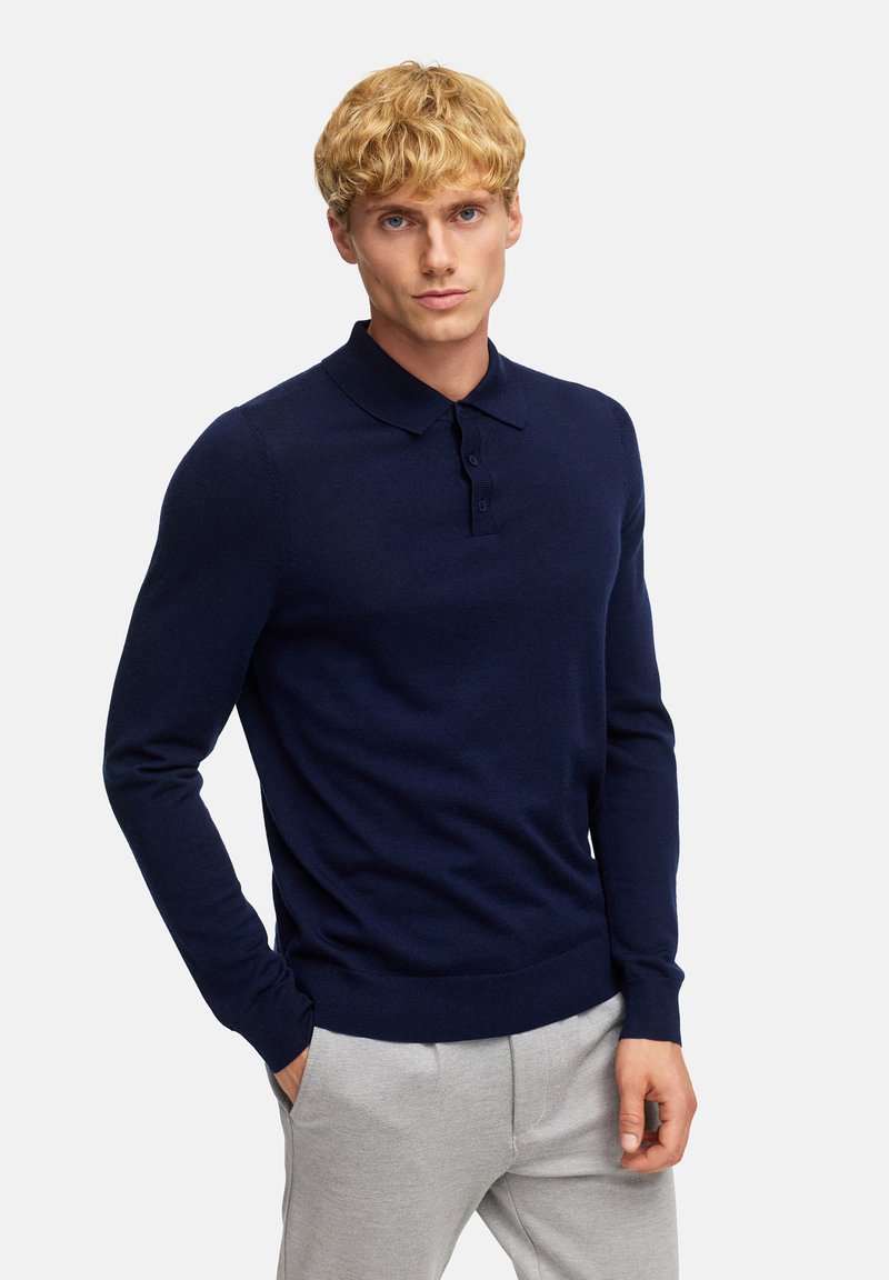 Marineblaues Langarm-Polo-Pullover mit einem kragenförmigen Halsauschnitt, ausgestattet mit einer Knopfleiste und gerippten Bündchen. Weicher, gestrickter Stoff mit schlanker Passform.