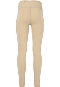 Beiga leggings tillverkade av stretchigt tyg, med hög midja, platta sömmar och en sidoficka för förvaring. Slät textur.