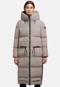 Long, padded coat with a light grey color, high collar, black zip closure, and drawstrings at the waist. Features large pockets and a matte finish.
