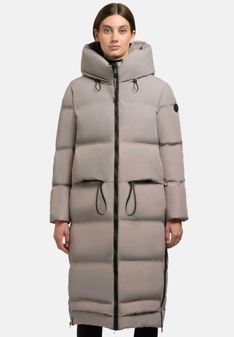 Long, padded coat with a light grey color, high collar, black zip closure, and drawstrings at the waist. Features large pockets and a matte finish.