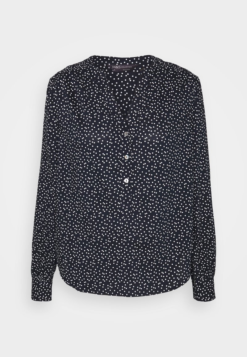 Marineblaue Bluse mit einem weißen Punktmuster, V-Ausschnitt, Knopfleiste, langen Ärmeln mit knöpfbaren Manschetten und einem lockeren Schnitt.