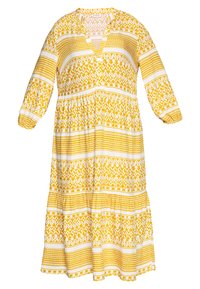 Långärmad maxiklänning i gult och vitt mönster med V-ringning och elastiska ärmslut, med en design av en flerlagers kjol.