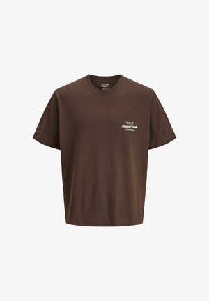 T-shirt en coton marron à manches courtes avec un petit texte blanc sur la poitrine gauche indiquant "Originals Studio" ainsi que d'autres détails de la marque.