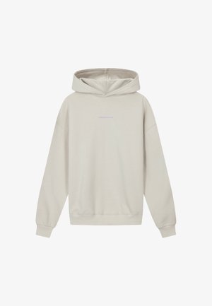 Hellbeige Kapuzenpullover mit langen Ärmeln und kleinem, zentrierten "TOMORROWLAND"-Text in hellviolett auf der Brust.