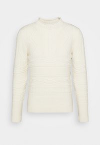 Pull en tricot de couleur crème avec un col haut, présentant des motifs texturés, des poignets côtelés et une silhouette ajustée.