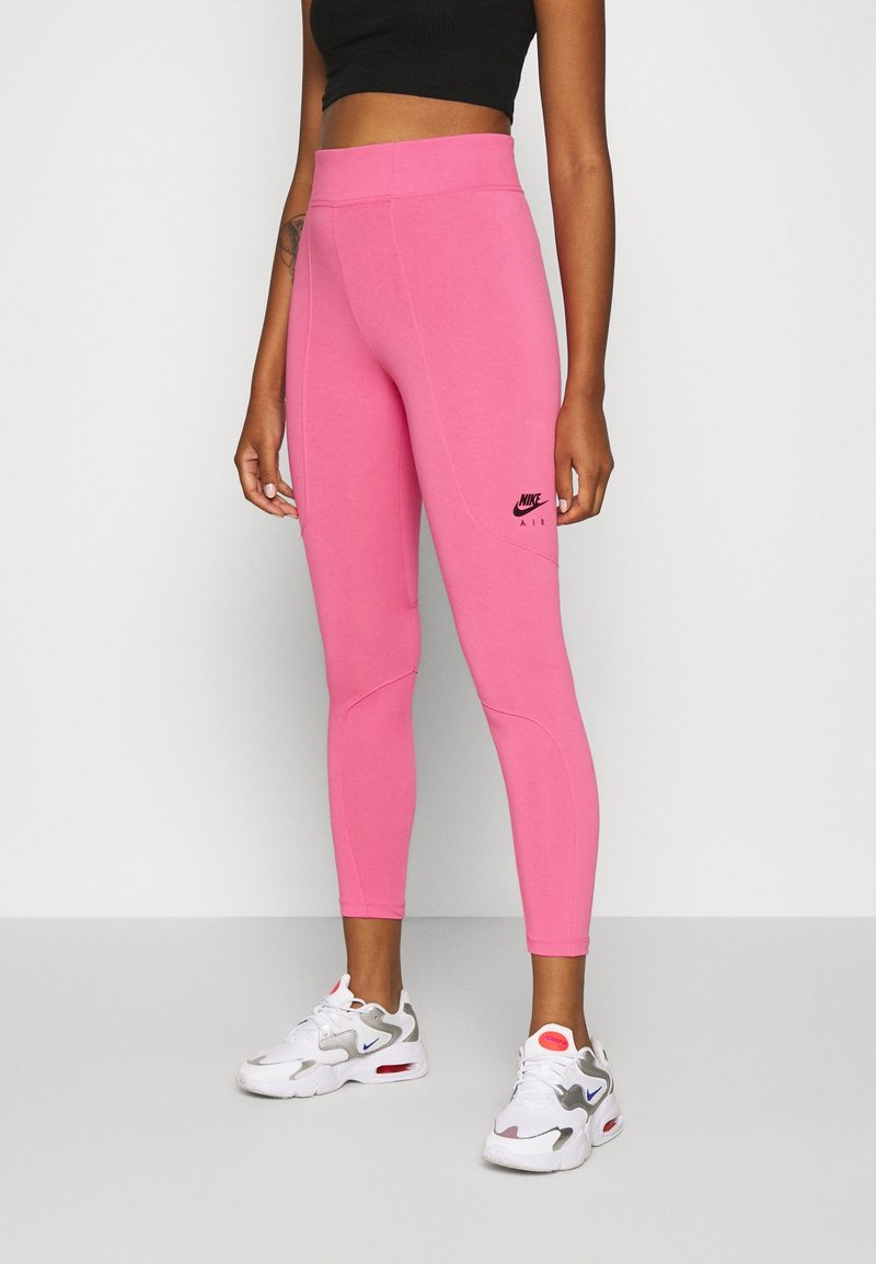 Rosa, figurnära leggings med hög midja och sydda detaljer, med en liten svart Nike Air-logotyp på höftområdet.