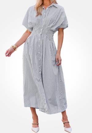 Sukienka na guziki w paski z krótkimi rękawami, taliowana w pasie i z rozkloszowanym dołem. Materiał lekki, z wąskimi czarno-białymi paskami.